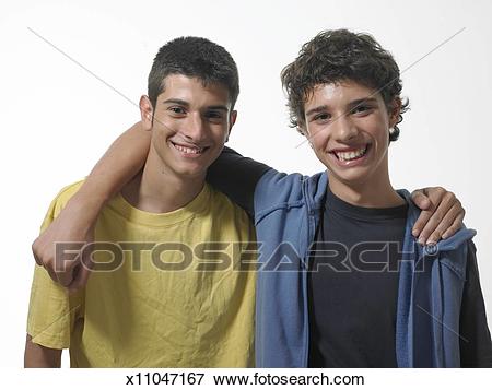 two-teenage-boys-15-17-with-arms-stock-photo__x11047167